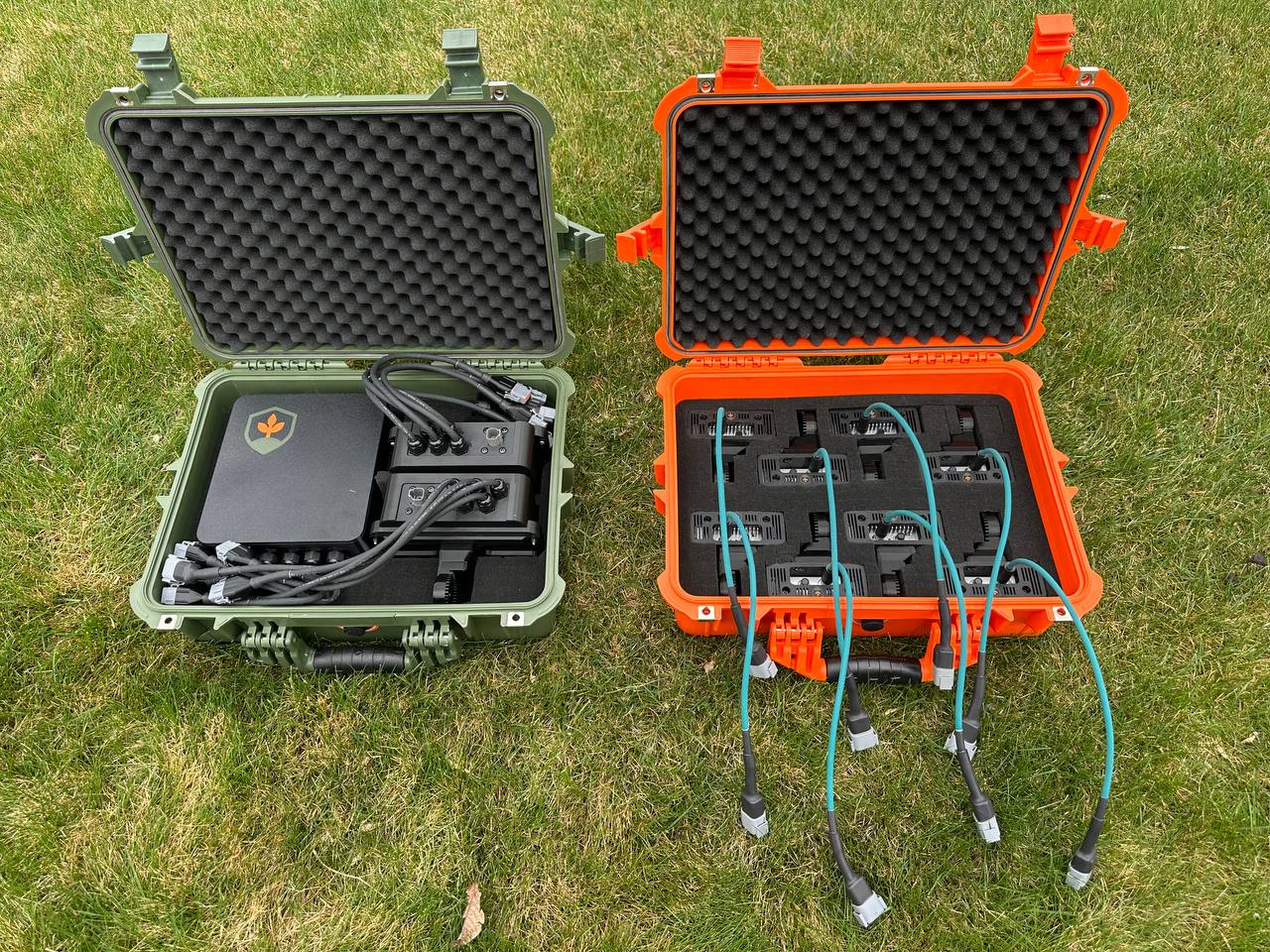 FarmDefender kit packed in weatherproof cases — central ECU and camera units ready to install on a boom